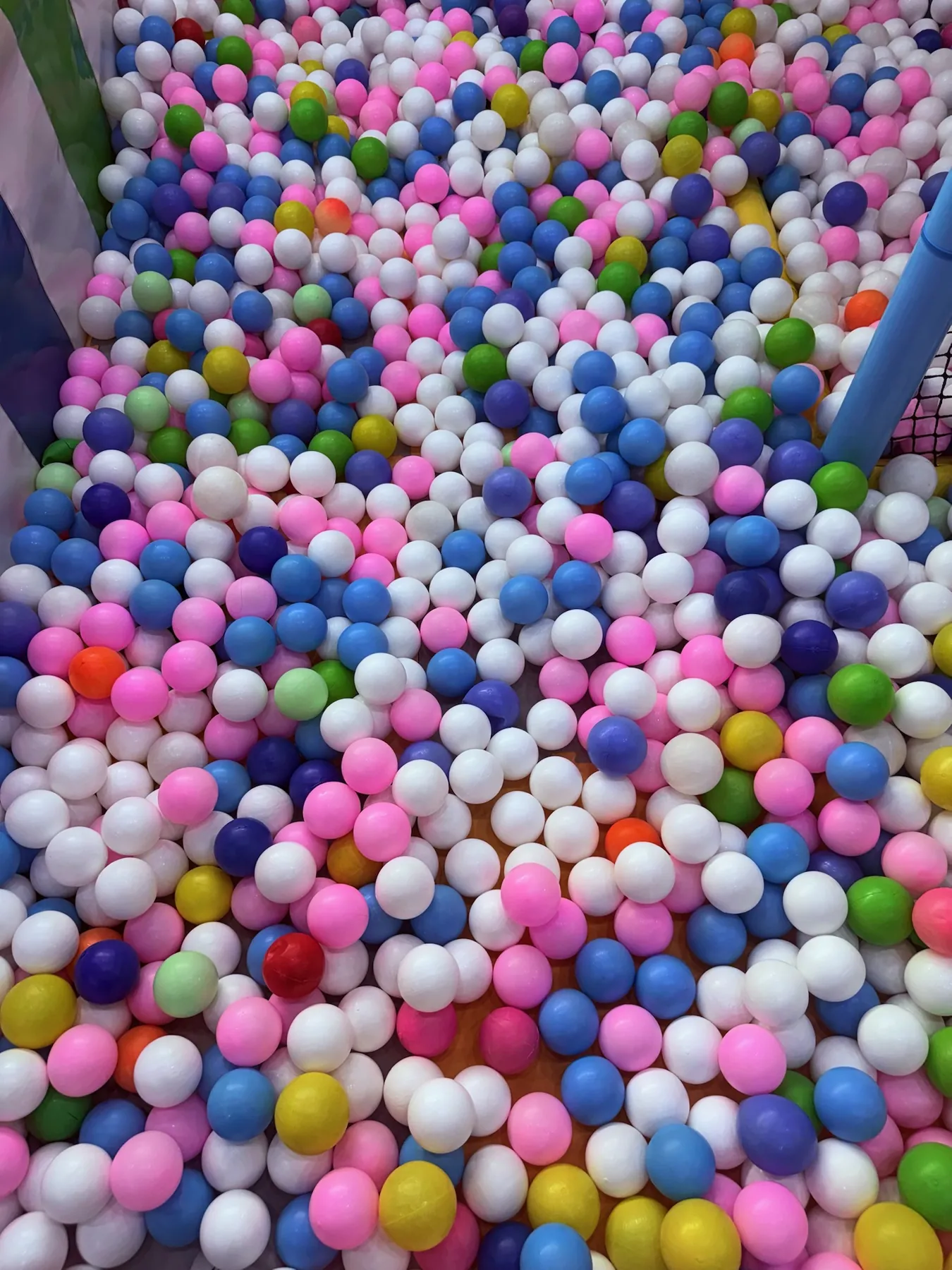 Ball pool filled with pastel coloured balls at Lopa